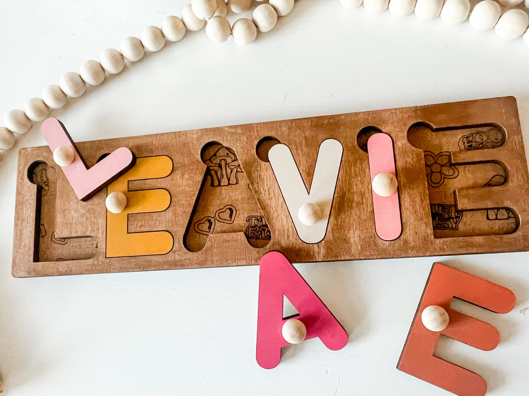 Name puzzle stained (peg & slots)